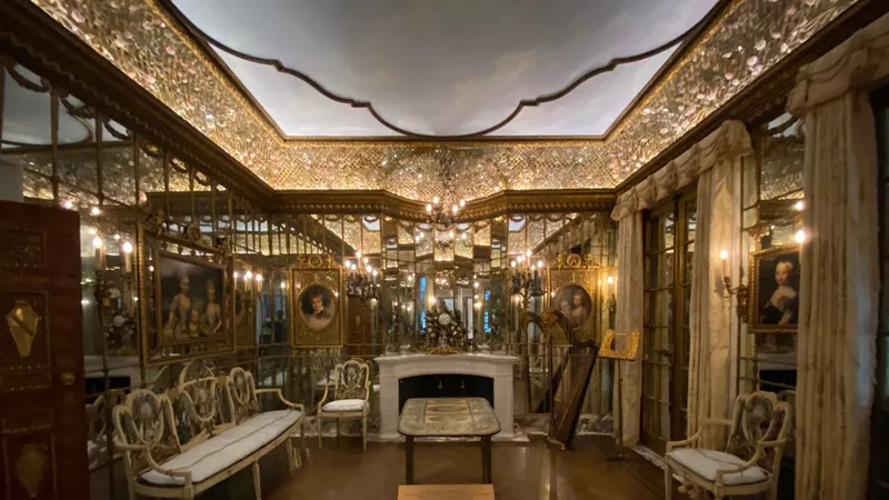 Ornate gilded mirrored room inside a Fifth Avenue mansion on a New York architecture tour of Gilded Age interiors