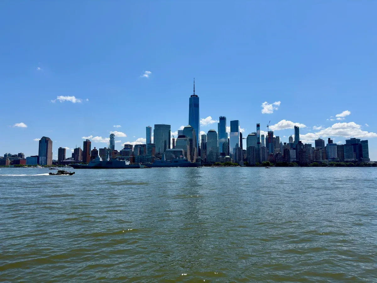 The Lower Manhattan skyline with One World Trade Center seen across the water of the Hudson River, on a New York architecture tour